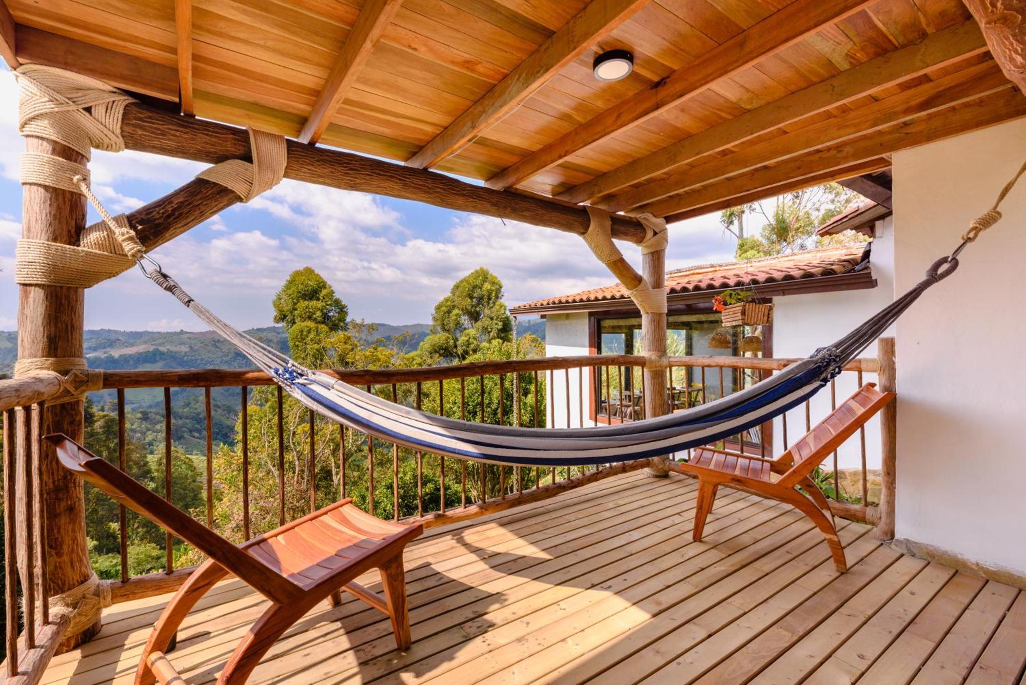 Hotel Kawa Mountain Retreat Salento Kültér fotó A hammock on a balcony